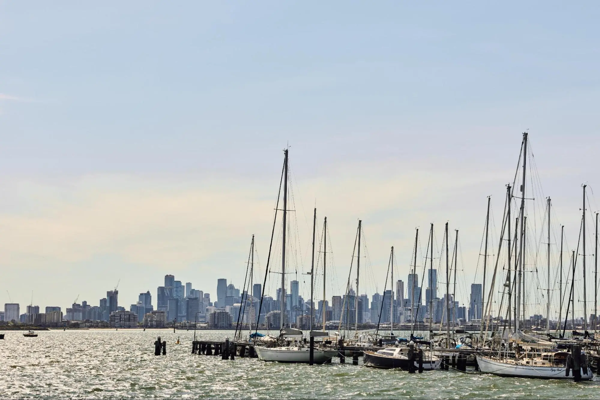 Williamstown waterfront marina with yachts against Melbourne city skyline